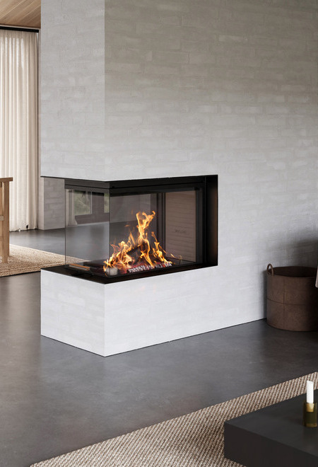 Wood fireplace VISIO 3:1 UNIQ as a room divider between the dining room and living room