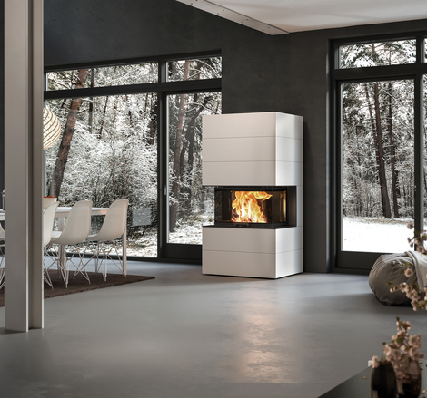 Wood fireplace VISIO 3 ELEMENT installed in white-painted concrete elements as a free-standing 3-sided fireplace in the centre of the room