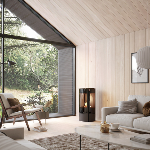 CARO 90 BIO bioethanol stove in black in a bright living room with lots of wood