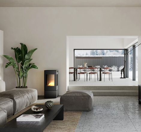 NEXO 100 BIO bioethanol stove in black in a living room with a sofa