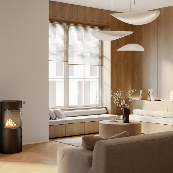 VIVA 100 L bioethanol stove in black in a bright, modern living room with a cosy seating area