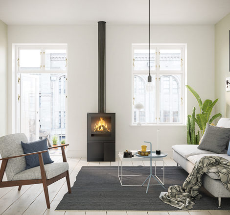 Gas stove Q-TEE 2 with steel door and practical base unit in a stylish flat in the centre of the city