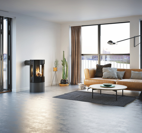 Gas stove VIVA 100 L in platinum with glass door in a minimalist flat with a view of the skyline