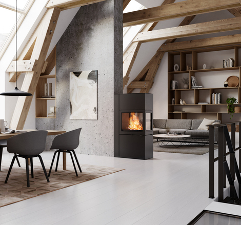 Stove 600 RD in black acts as a room divider between the dining room and modern living room