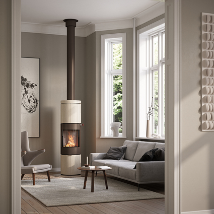 JUNO 166 L with natural stone Porto cladding and steel door in the colour mocha in a modern living room with large window fronts