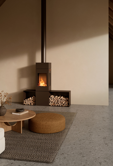 NEXO 140 wood-burning stove in the colour mocha in a simple and bright living room