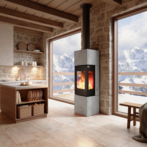 NEXO 160 Soapstone wood stove in black in a living room with mountains