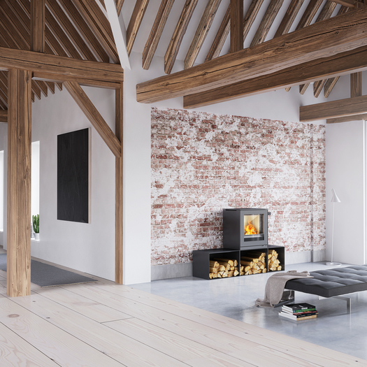 Wood stove Q-TEE 2 in black with side benches in a minimalist furnished, rustic house 