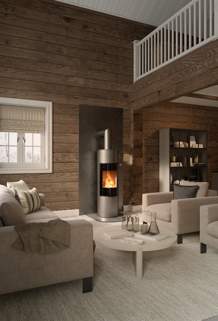Wood stove VIVA 140 L in platinum colour with glass doors on a wooden wall in a rustic house