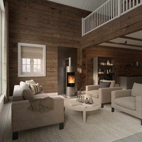 Wood stove VIVA 140 L in platinum colour with glass doors on a wooden wall in a rustic house