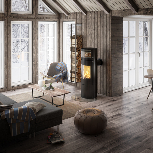 Wood stove VIVA L oven in black with integrated baking compartment, in which fresh bread is baked with the heat of the fire