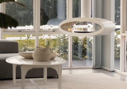 Ellipse Ceiling Bioethanol fireplace in white in the living room with a table and sofa
