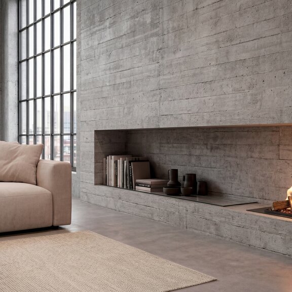 Logicwood Linear Bioethanol fireplace built into a concrete wall in the living room, with a beige sofa and rug