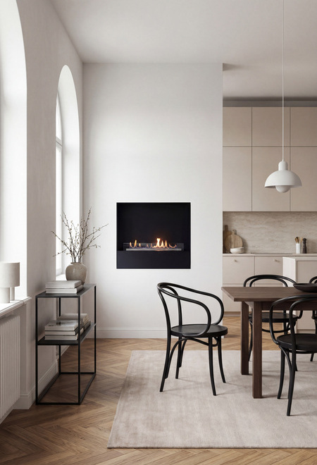 Bioethanol fireplace Milan with a black front panel, built into a white wall in the dining room of a flat in an old building with wooden parquet flooring