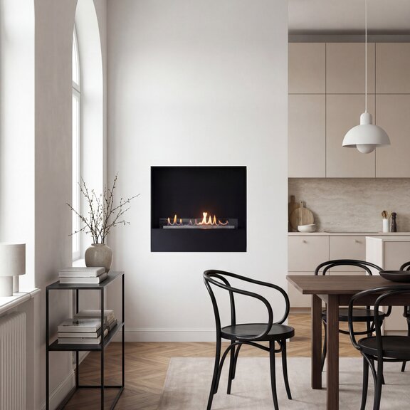 Bioethanol fireplace Milan with a black front panel, built into a white wall in the dining room of a flat in an old building with wooden parquet flooring