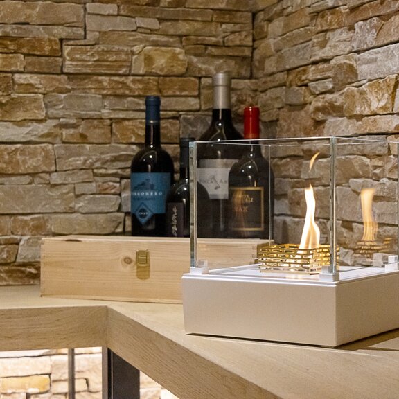 Nice bioethanol burner in a wine cellar with a stone wall